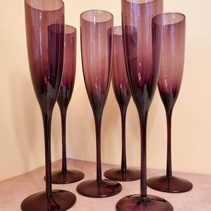 Six plum colored champagne flutes
